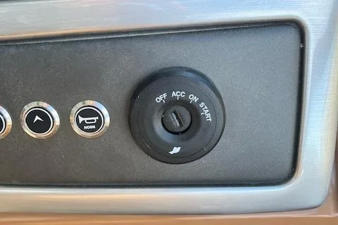 Slide: The Image of 2024 Regency 230 LE3 ignition switch and control buttons. - 26