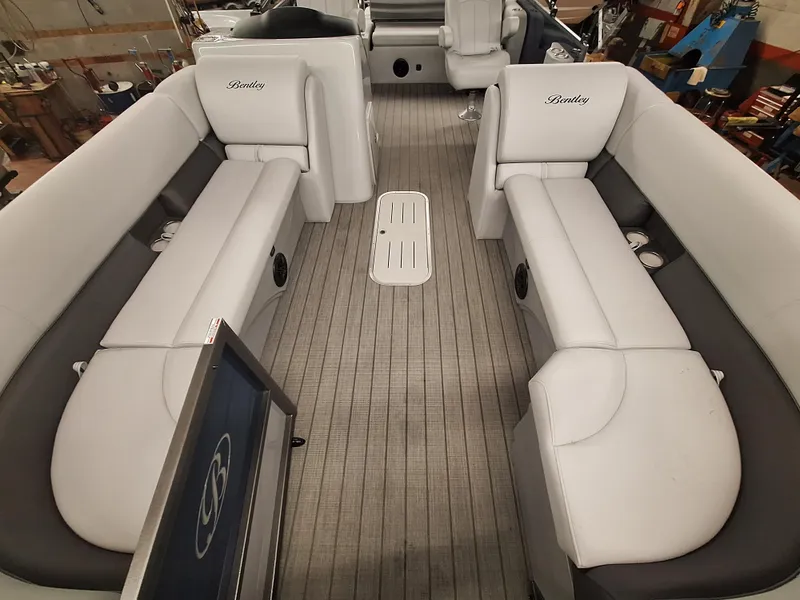 Slide: The Image of 2024 Bentley Pontoons Legacy 243 Swingback interior with white seating. - 3