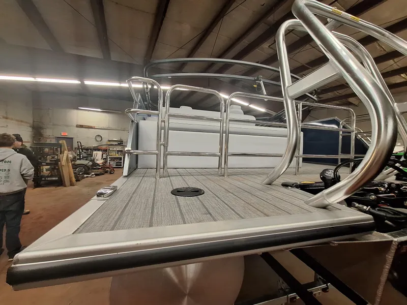 Slide: The Image of 2024 Bentley Pontoons Legacy 243 Swingback in a warehouse. - 7