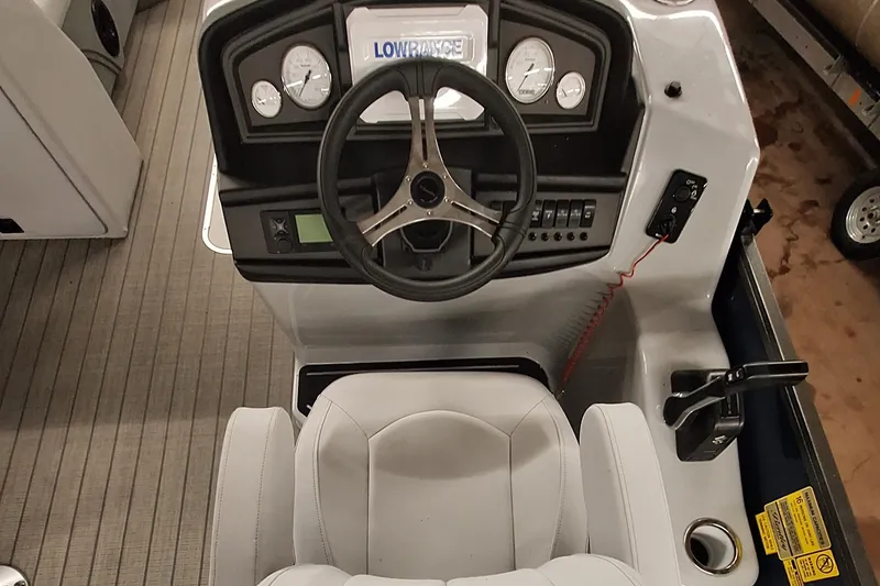 Slide: The Image of 2024 Bentley Pontoons Legacy 243 Swingback helm with steering wheel and control panel. - 9