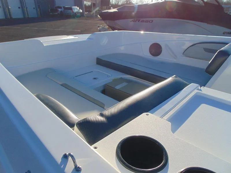 Slide: The Image of 2024 Hurricane SunDeck Sport 205 OB boat interior with seating and cup holders. - 6