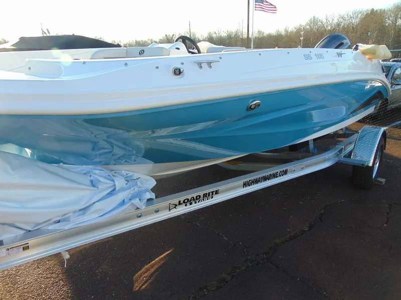 Slide: The Image of 2024 Hurricane SunDeck Sport 185 OB boat on a Load Rite trailer. - 7