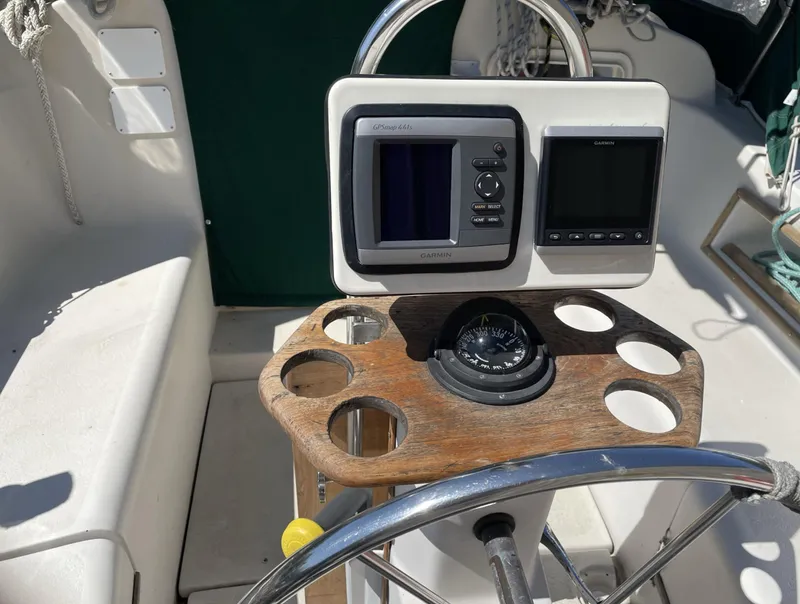 Slide: The Image of Cockpit of 1983 Irwin Citation 34 sailboat with navigation instruments and compass. - 11
