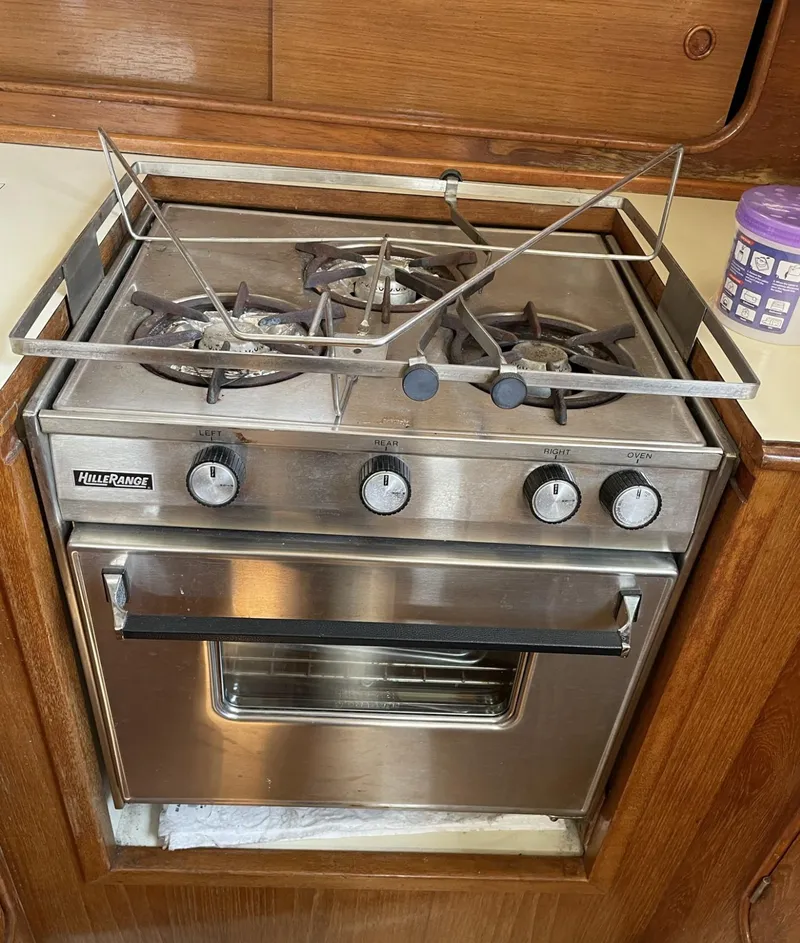 Slide: The Image of Stainless steel stove and oven in 1983 Irwin Citation 34 sailboat galley. - 12