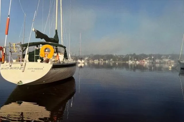 Slide: The Image of 1983 Irwin Citation 34 sailboat docked in a calm harbor. - 3