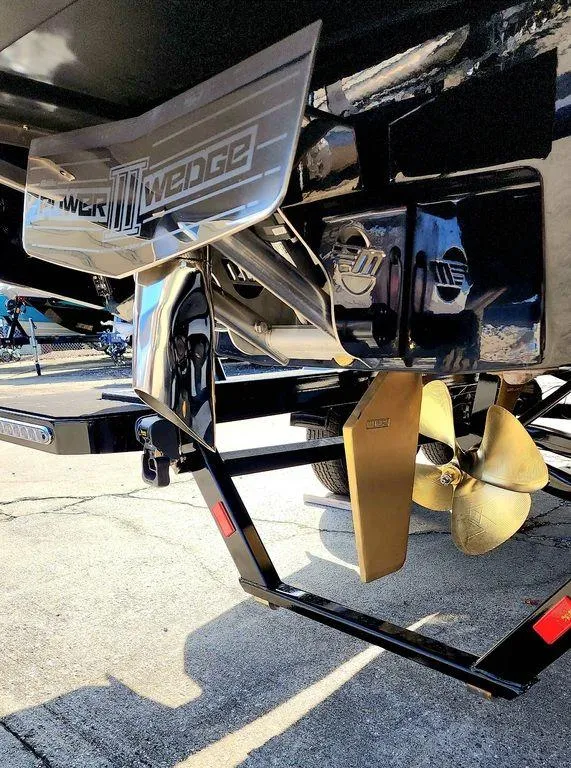 Slide: The Image of 2024 Malibu 23 MXZ Power Wedge and propeller close-up. - 7