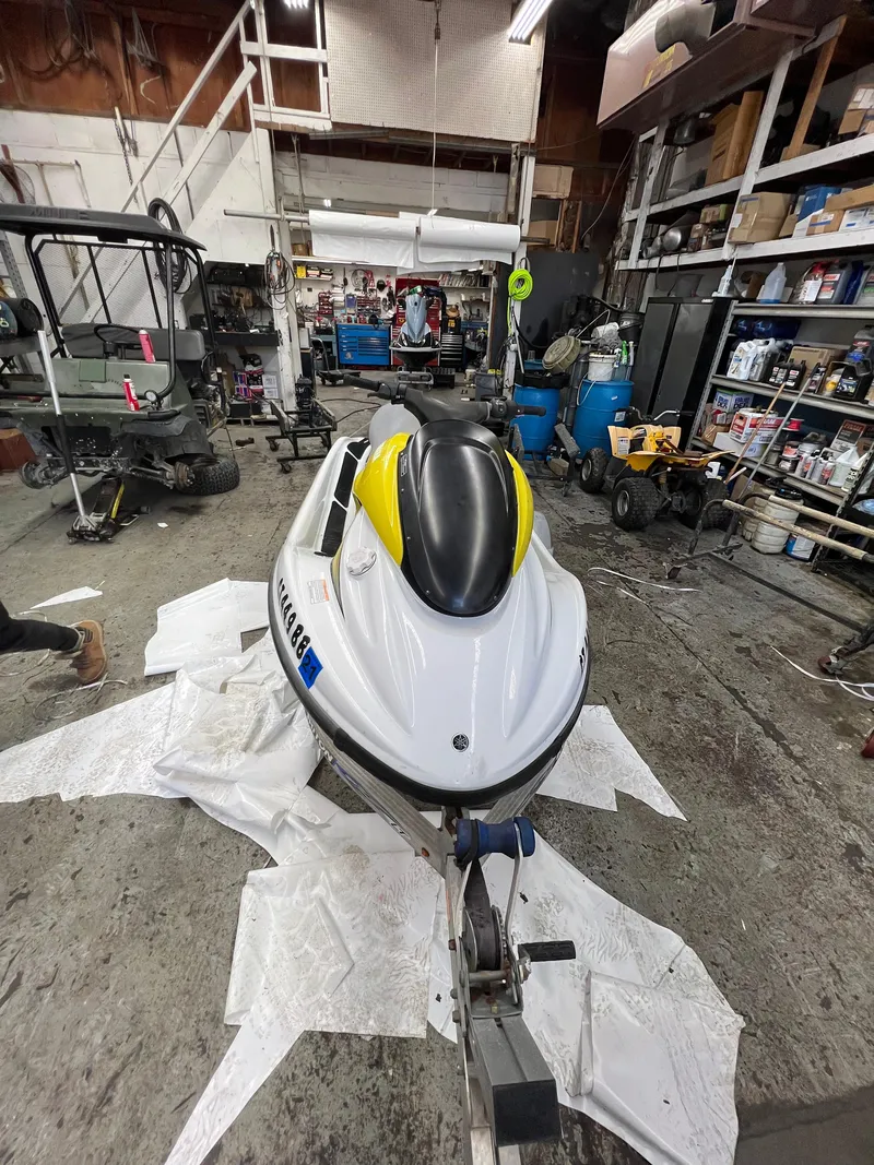 Slide: The Image of 2005 Yamaha WaveRunner GP 800R in a workshop for maintenance. - 6