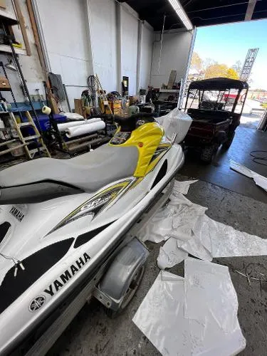 Slide: The Image of 2005 Yamaha WaveRunner GP 800R in a workshop, surrounded by tools and materials. - 8