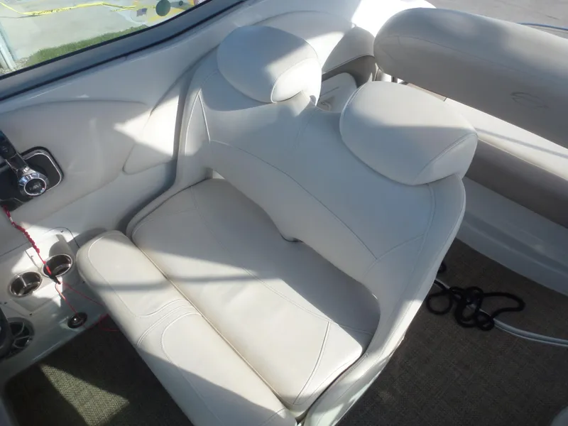 Slide: The Image of 2019 Crownline 264 CR boat interior with white leather seating. - 14