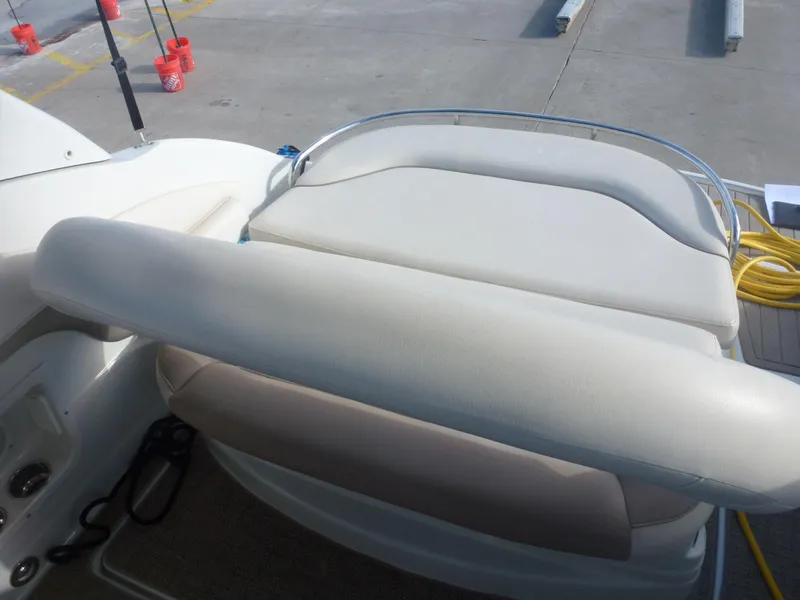 Slide: The Image of 2019 Crownline 264 CR boat seating area at dock. - 15