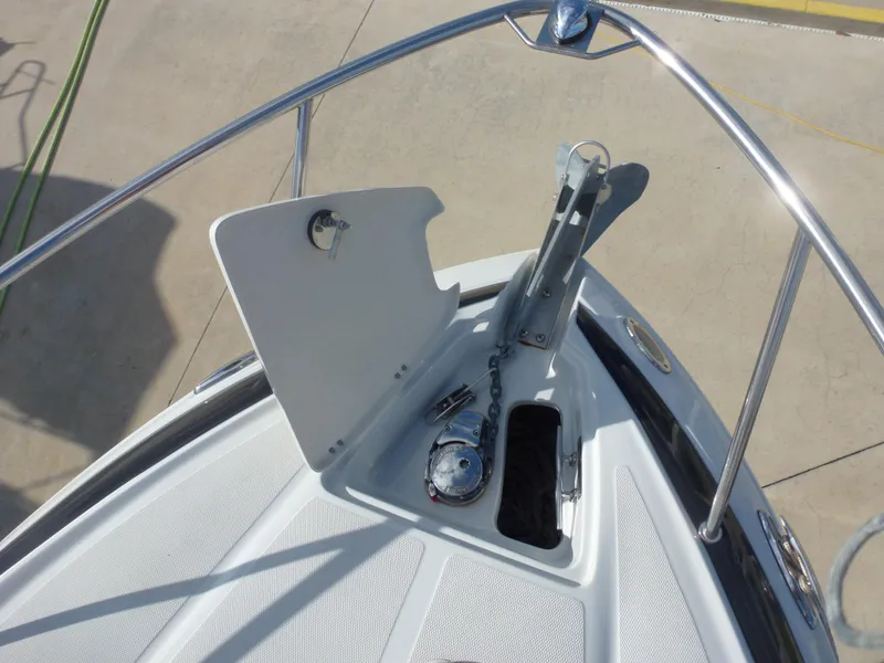 Slide: The Image of 2019 Crownline 264 CR boat anchor compartment and bow deck. - 8