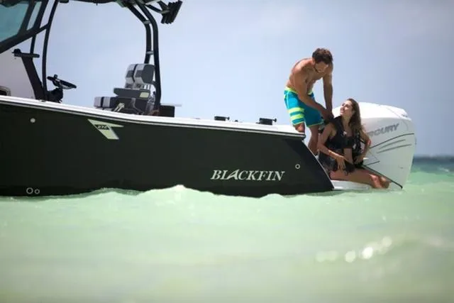 Slide: The Image of 2024 Blackfin 272CC boat with people enjoying the water. - 12
