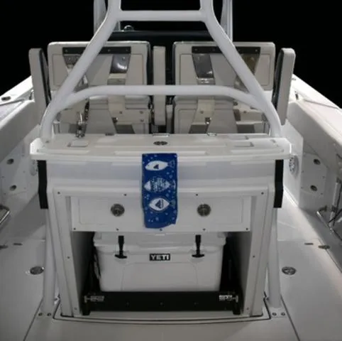 Slide: The Image of 2024 Blackfin 272CC boat interior with seating and Yeti cooler. - 17