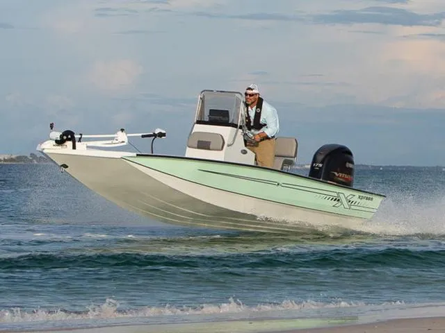 Slide: The Image of 2024 Xpress Boats H22B cruising on open water, showcasing speed and performance. - 1