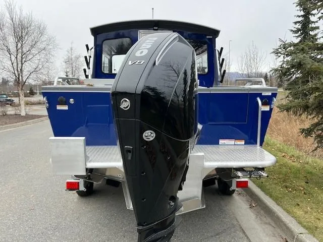 Slide: The Image of 2023 Spartan 220 Maximus Pro boat with powerful V8 engine, parked on a road. - 10