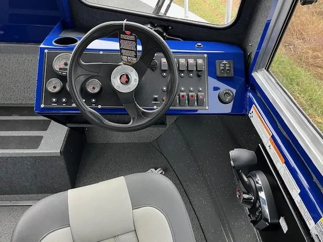 Slide: The Image of 2023 Spartan 220 Maximus Pro dashboard with steering wheel and control panel. - 9