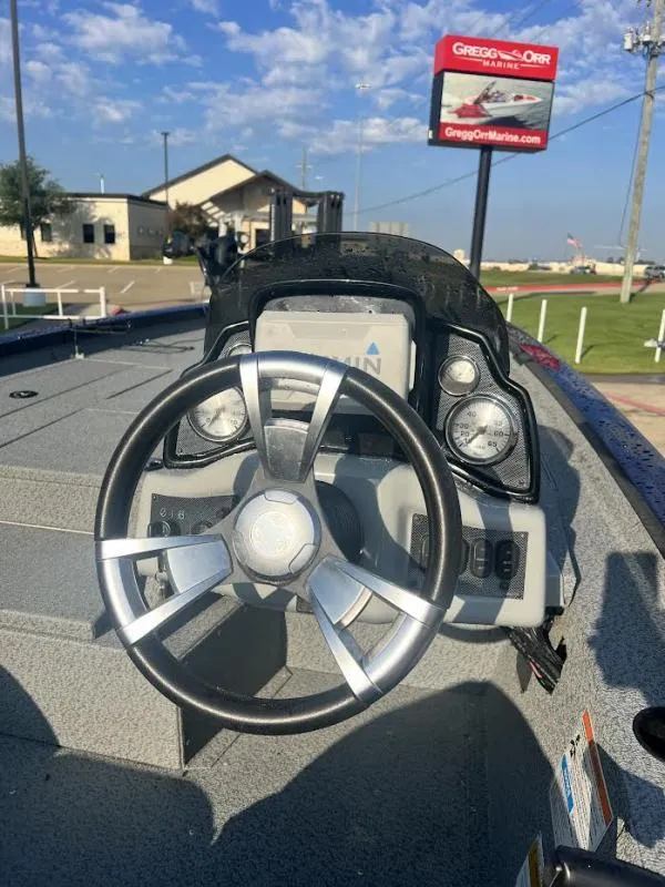 Slide: The Image of 2017 G3 Sportsman 19 boat dashboard with steering wheel and gauges at Gregg Orr Marine. - 13