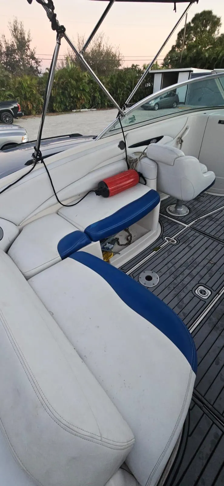 Slide: The Image of 2002 Monterey 262 Cruiser boat interior with white and blue seating. - 4