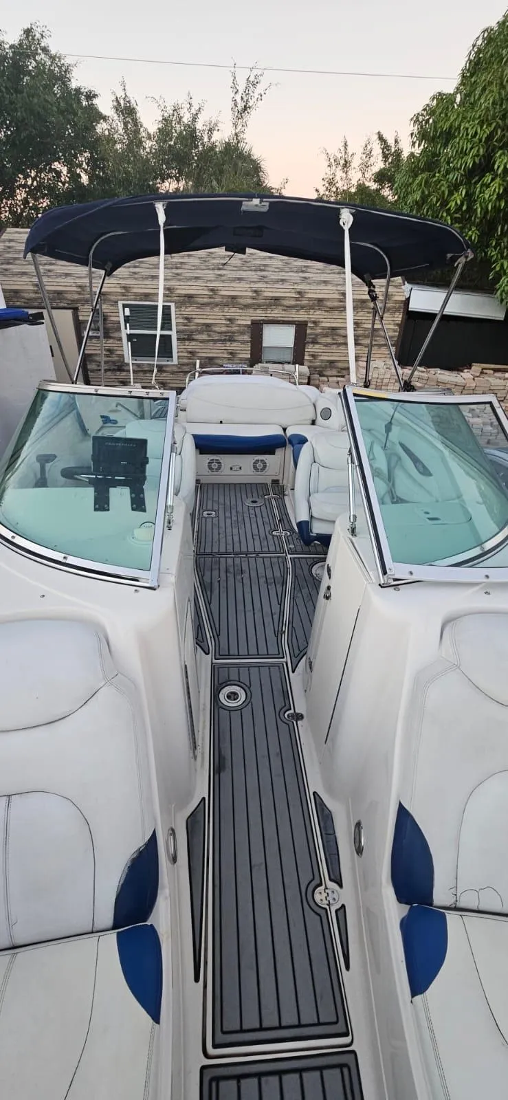 Slide: The Image of 2002 Monterey 262 Cruiser boat with spacious deck and seating area. - 7
