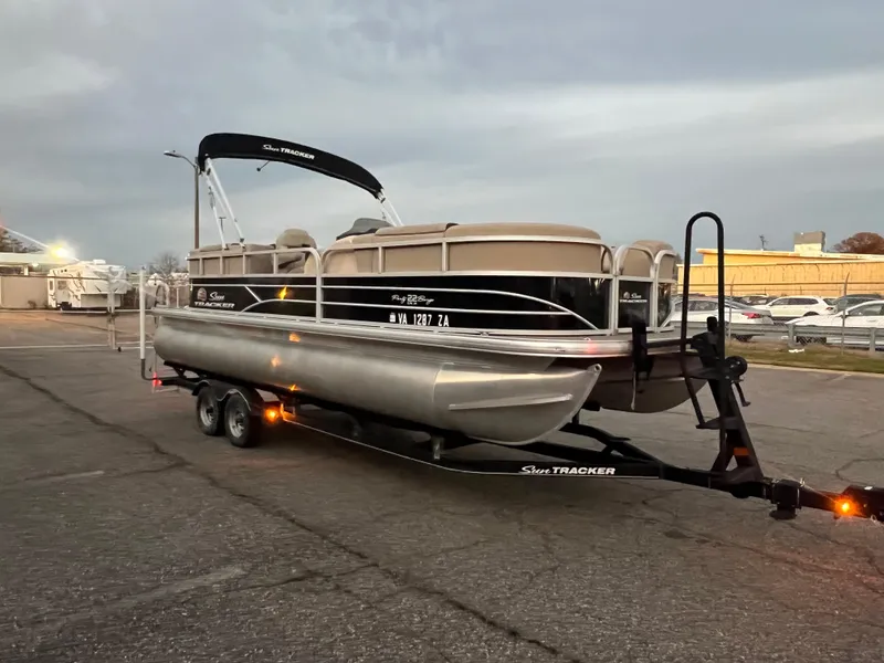 The Image of 2018 Sun Tracker Party Barge 22 DLX pontoon boat on trailer. - 0