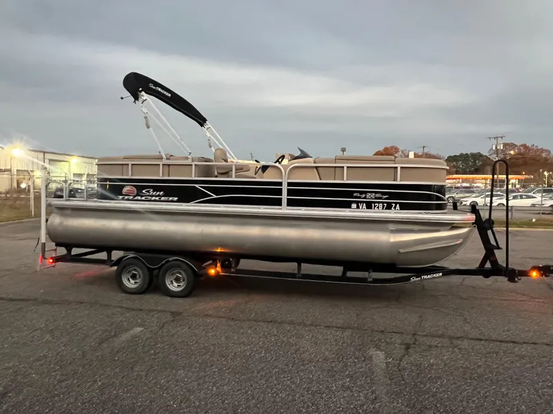Slide: The Image of 2018 Sun Tracker Party Barge 22 DLX pontoon boat on a trailer. - 11