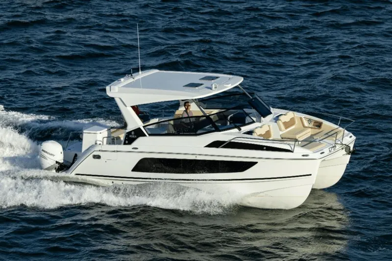 Slide: The Image of 2024 Aquila 36 Sport cruising on open water. - 1