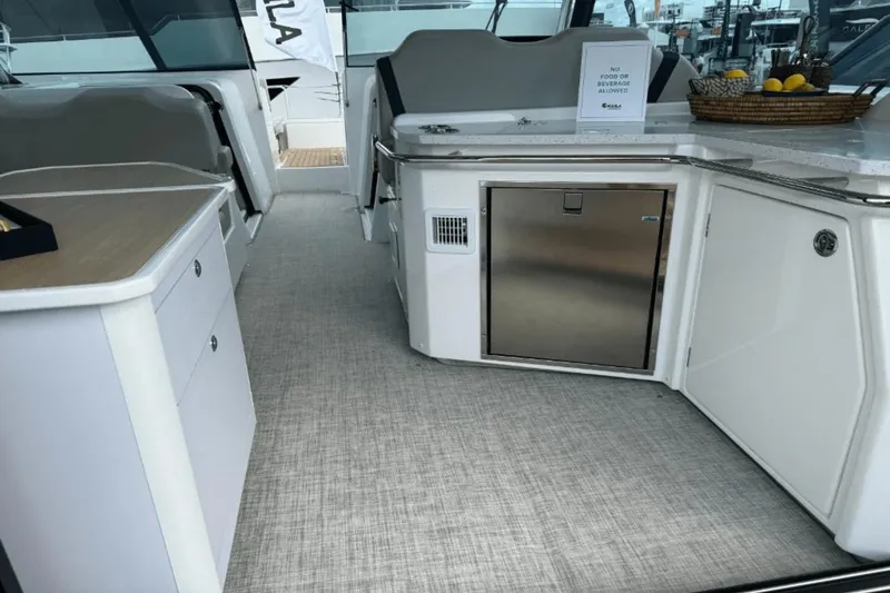 Slide: The Image of Interior of 2024 Aquila 36 Sport yacht with modern kitchen and storage areas. - 10