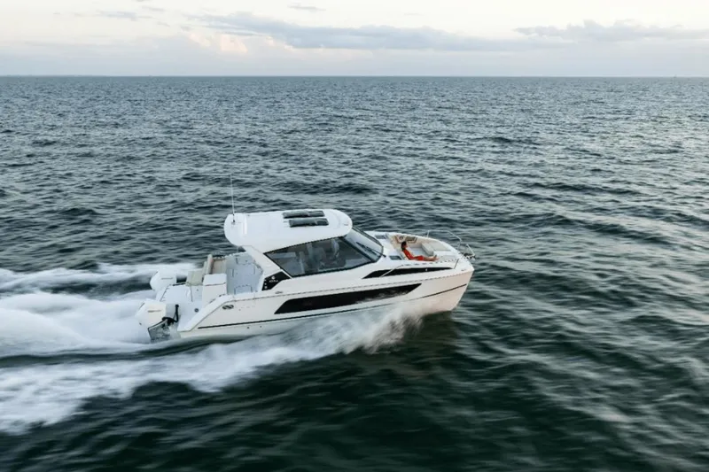 Slide: The Image of 2024 Aquila 36 Sport cruising on open water. - 2