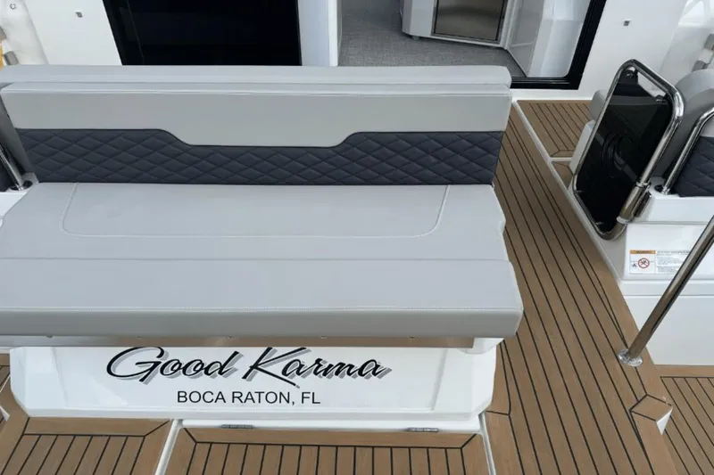 Slide: The Image of 2024 Aquila 36 Sport boat with Good Karma name, Boca Raton, FL, cushioned seating. - 6