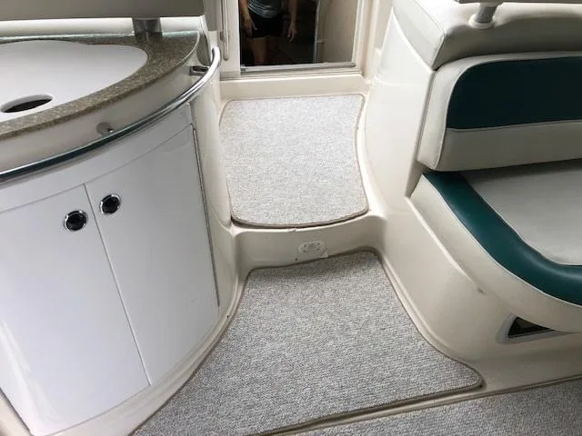 Slide: The Image of Interior of 1998 Maxum 3700 SCR boat with sink and seating area. - 10