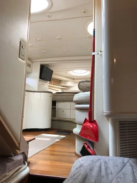 Slide: The Image of Interior of a 1998 Maxum 3700 SCR yacht with modern amenities. - 20