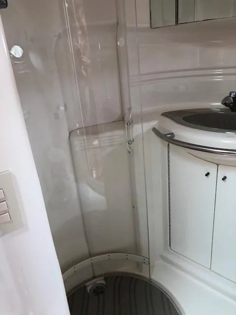 Slide: The Image of 1998 Maxum 3700 SCR bathroom with sink and shower. - 25