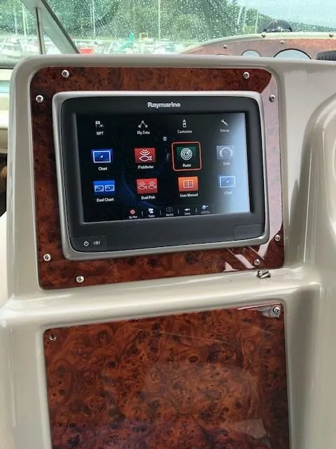 Slide: The Image of Raymarine navigation system on 1998 Maxum 3700 SCR boat dashboard. - 26