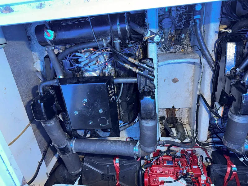 Slide: The Image of Engine compartment of a 1998 Maxum 3700 SCR boat with visible components. - 30