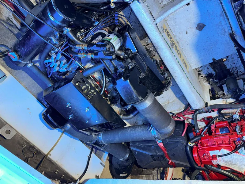 Slide: The Image of 1998 Maxum 3700 SCR engine compartment with visible components and wiring. - 31