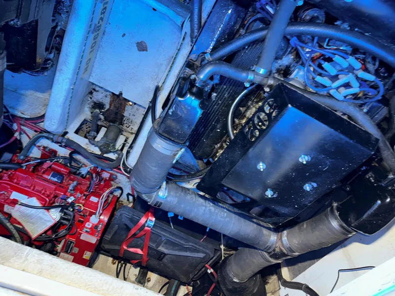 Slide: The Image of Engine compartment of a 1998 Maxum 3700 SCR boat with visible components and wiring. - 32