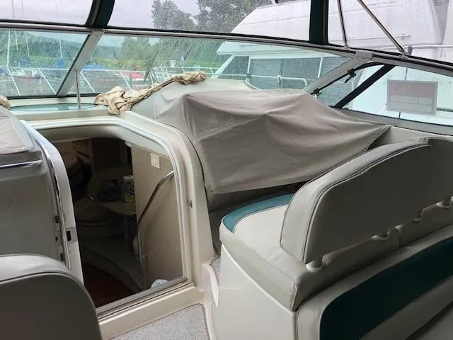 Slide: The Image of 1998 Maxum 3700 SCR boat interior with covered helm and seating area. - 7