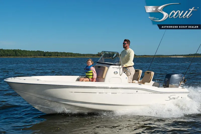 The Image of 2024 Scout 175 Sportfish boat cruising on a lake with two passengers. - 0