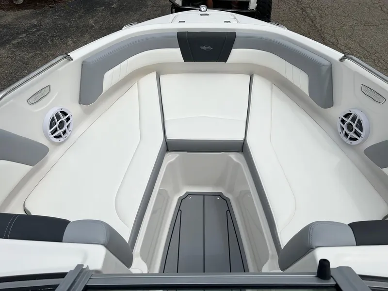 Slide: The Image of 2024 Chaparral 21 SSi boat interior with white and gray seating. - 2