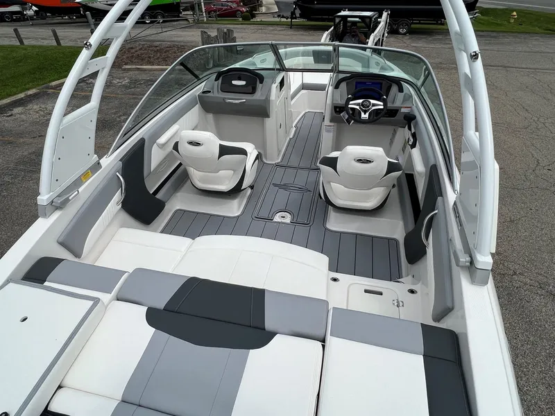 Slide: The Image of 2024 Chaparral 21 SSi boat interior with modern seating and sleek design. - 4
