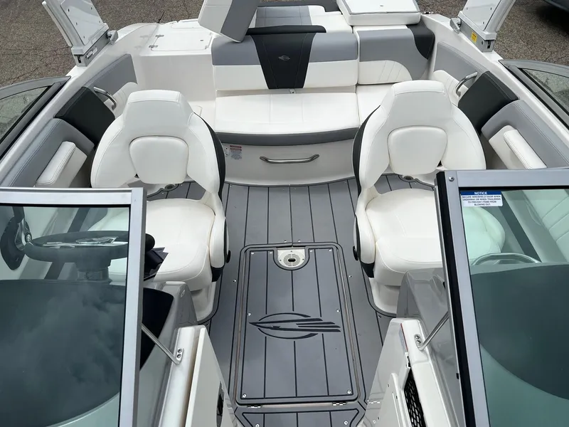 Slide: The Image of 2024 Chaparral 21 SSi boat interior with white seating and sleek design. - 5