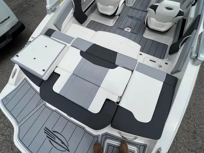 Slide: The Image of 2024 Chaparral 21 SSi boat interior with gray and white seating. - 8