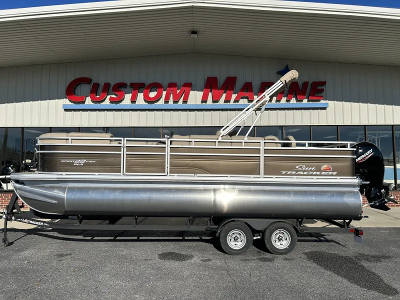 The Image of 2024 Sun Tracker SportFish 22 DLX pontoon boat at Custom Marine dealership. - 1