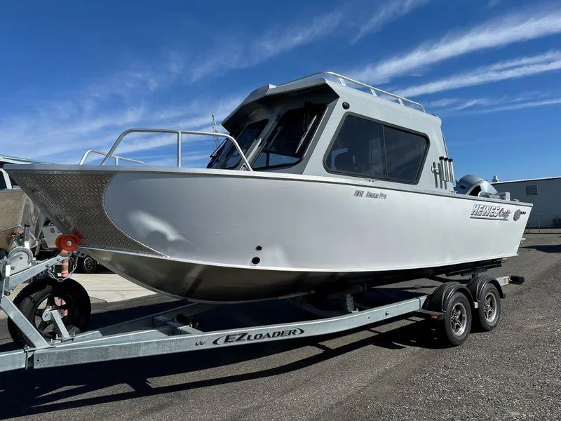 The Image of 2024 Hewescraft 220 Ocean Pro HT ET boat on EZ Loader trailer. - 0