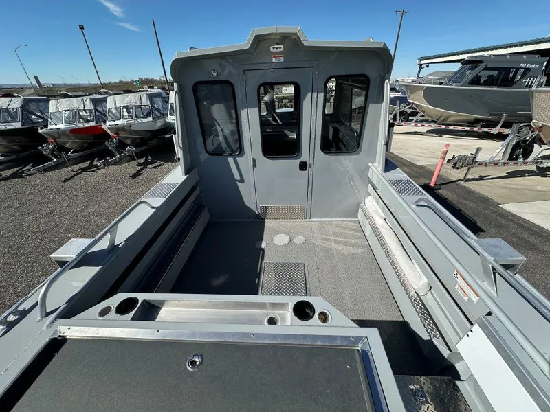 Slide: The Image of 2024 Hewescraft 220 Ocean Pro HT ET boat interior, spacious deck, and cabin view. - 4