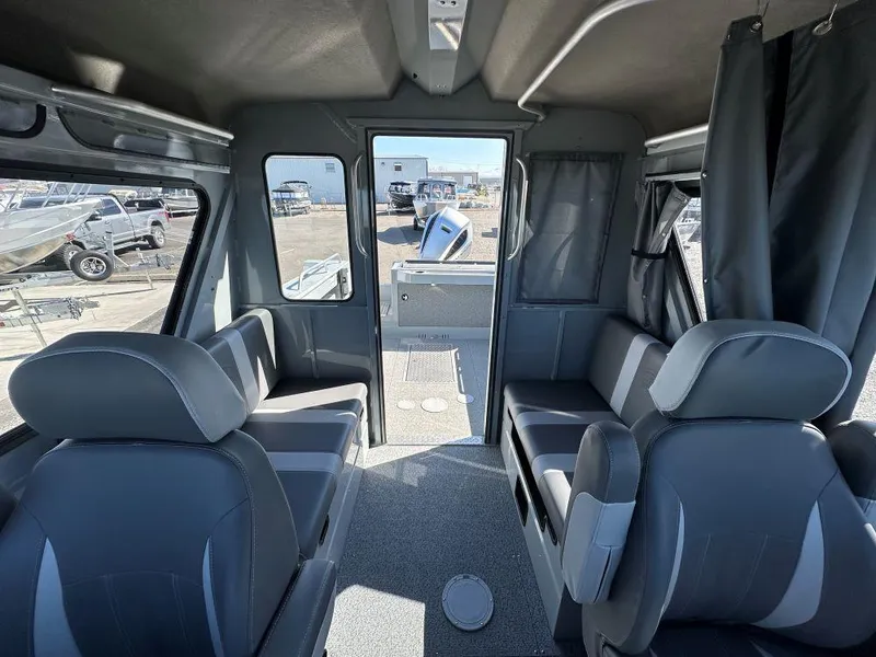 Slide: The Image of Interior of 2024 Hewescraft 220 Ocean Pro HT ET boat with seating and windows. - 8
