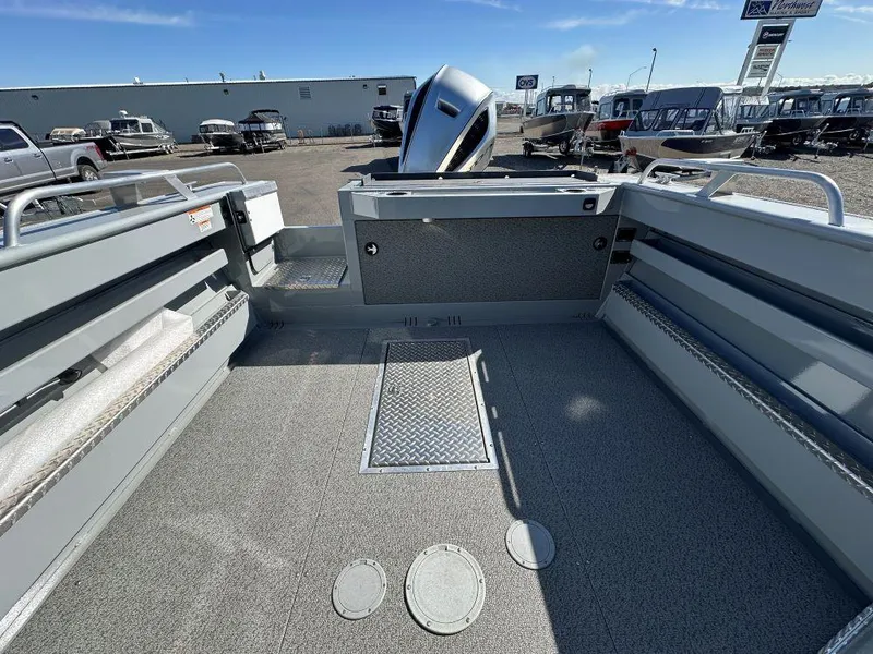 Slide: The Image of 2024 Hewescraft 220 Ocean Pro HT ET boat interior with outboard motor. - 9