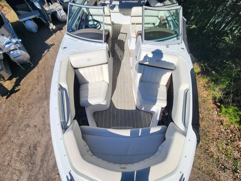 Slide: The Image of 2011 Cobalt A25 boat with spacious seating and open deck layout. - 20