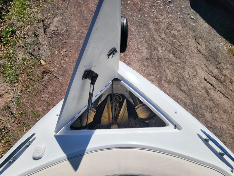 Slide: The Image of 2011 Cobalt A25 boat with open bow storage compartment. - 22