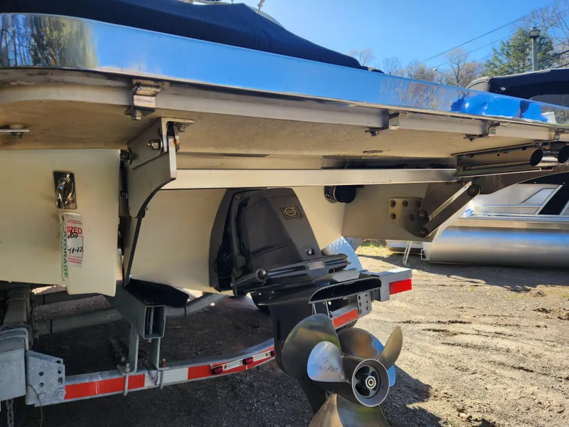 Slide: The Image of 2011 Cobalt A25 boat stern with propeller and trailer. - 4